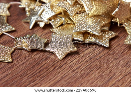 golden stars decoration over dark brown wooden background