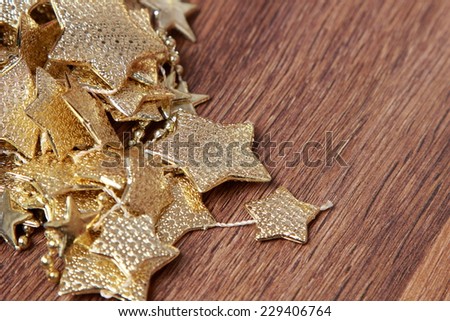 Christmas decoration golden stars over rustic Elm wood background - retro style design, copy space/chritmas decoration golden stars over wooden background o Holiday theme