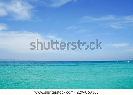 Bright blue sky, white cloud and clear sea water. Seascape outdoors vacation. Summer concept. Nature background.