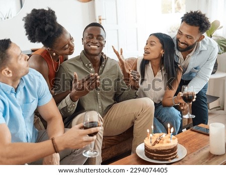 This is my day. Shot of a young man celebrating his birthday with friends at home.