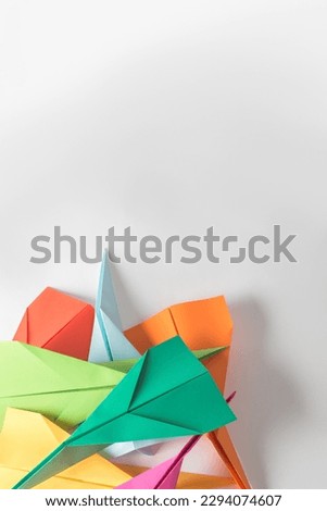 Give your creativity wings to fly. Studio shot of a pile of colourful origami planes.