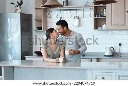 My comfort. Shot of a young couple having a cup of coffee together at home. Royalty-Free Stock Photo #2294074719