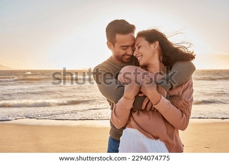 Young diverse biracial couple having fun at the beach together. Young diverse biracial couple having fun at the beach together. Royalty-Free Stock Photo #2294074775