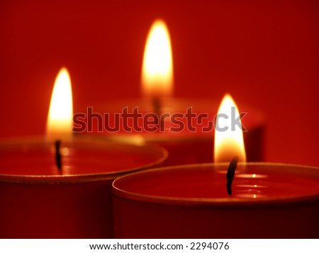 Close-up of red candle lights on a row