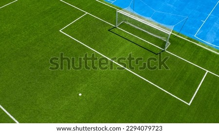 Aerial closeup of the penalty spot on an empty synthetic grass soccer field. Here a penalty is taken in a soccer game. Royalty-Free Stock Photo #2294079723
