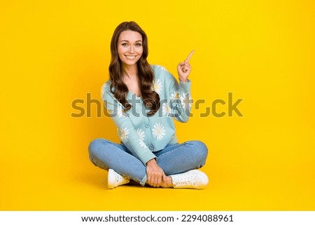 Full body photo of young promoter marketer lady wear stylish outfit direct finger empty space new massage salon isolated on yellow color background