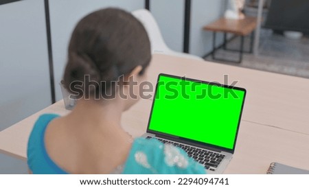 Indian Woman in Sari Using Laptop with Chroma Key