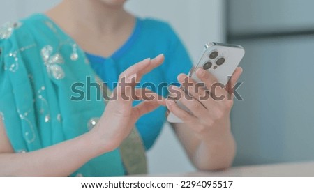 Close up of Businesswoman Hand Using Smartphone