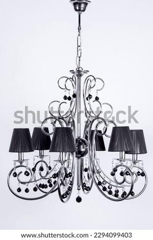 Modern Vintage Retro different models Silver bronze chandeliers hanging on white backdrop macro Detail shot interior decoration decorative electrical electronic lighting Industrial abstract pastel bac