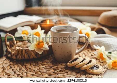 Cup of hot tea and spring home interior. good morning concept.