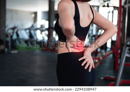 Asian slim woman play fitness at the gym,She pain from exercise Royalty-Free Stock Photo #2294108947