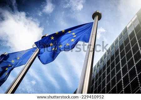 European Union flags on blue sky background Royalty-Free Stock Photo #229410952