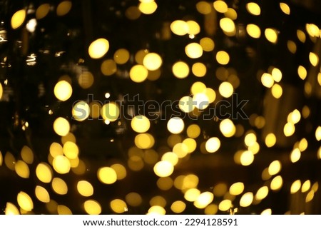 blur bokeh circus tube lamp hang from ceiling in dark room like firefly Royalty-Free Stock Photo #2294128591