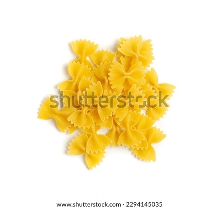 Raw Farfalle Pasta Isolated, Yellow Dry Butterfly Noodles, Wheat Bow Macaroni, Uncooked Farfalle in Wooden Bowl on White Background Top View