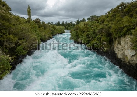 Huka Falls, a set of waterfalls on the Waikato River, which drains Lake Taupo in the North Island of New Zealand Royalty-Free Stock Photo #2294165163