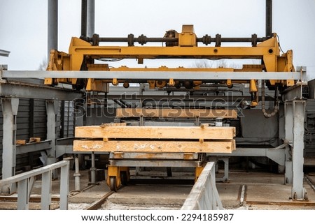 Sawmill. Process of machining logs in equipment sawmill machine saw saws the tree trunk on the plank boards. Wood sawdust work sawing timber wood wooden woodworking Royalty-Free Stock Photo #2294185987