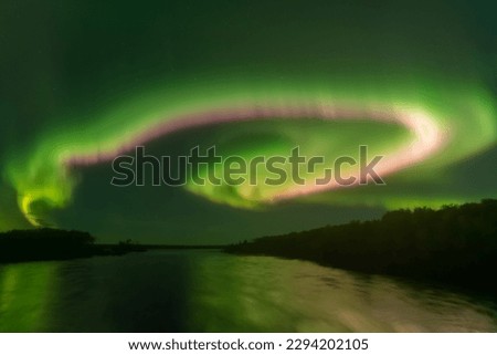 Northern Lights (Aurora Borealis) over the Churchill River in Saskatchewan. 