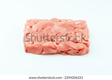 Fresh frozen pieces of turkey meat on a white background.Raw chicken.Ogranic food and healthy eating.Frozen chicken fillet.