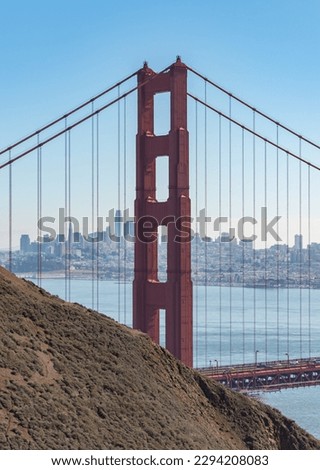 A picture of the Golden Gate Bridge Tower as seen from the Golden Gate View Point.