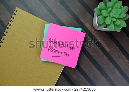 Concept of Qualitative Research write on sticky notes isolated on Wooden Table. Royalty-Free Stock Photo #2294213035