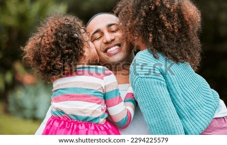 Being a dad is the best feeling in the world. Shot of two little girls kissing their father on his cheek.