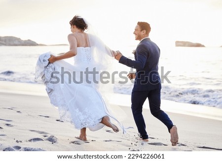 Im looking forward to years of adventure by your side. Shot of a young couple on the beach on their wedding day. Royalty-Free Stock Photo #2294226061