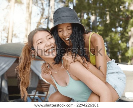We havent done this in ages. Shot of an attractive young woman giving her friend a piggyback ride during a day in the woods. Royalty-Free Stock Photo #2294226181