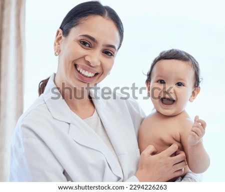 Her favourite doctor. Shot of a paediatrician examining a baby in a clinic. Royalty-Free Stock Photo #2294226263
