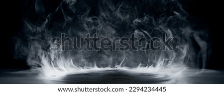 Real smoke exploding outwards with empty center. Dramatic smoke or fog effect for spooky Halloween background. Royalty-Free Stock Photo #2294234445