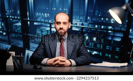 POV of system engineer talking on online videocall in data center server room, young adult working in artificial intelligence render farm. IT specialist using remote videoconference call. Royalty-Free Stock Photo #2294237513