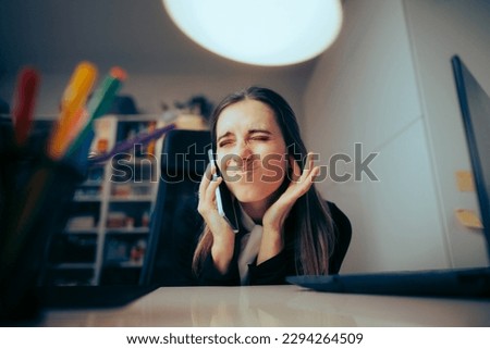 
Woman Speaking on the Phone in a Loud Home Office. Businesswoman having connection and signal problems during mobile conversation
 Royalty-Free Stock Photo #2294264509