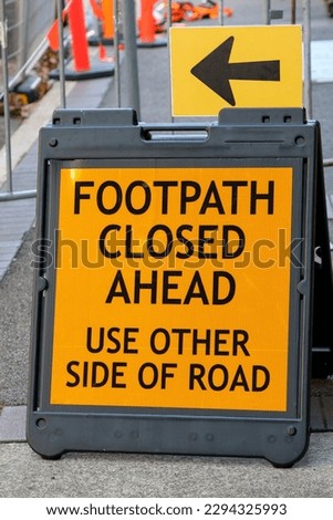 Footpath Closed Ahead: Use other side of road sign.