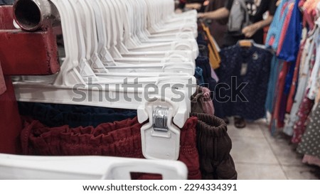 clothes hangers, clothes display in a shop, buying and selling activities