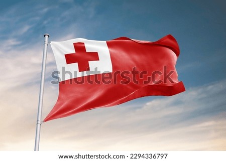 Waving flag of Tonga in beautiful sky. Tonga flag for independence day. The symbol of the state on wavy fabric. Royalty-Free Stock Photo #2294336797