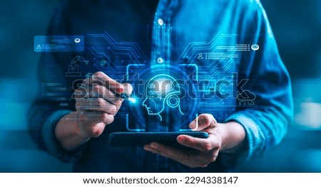 AI technology and Chatbot, as a businessman interacts with a virtual graphic on a global internet connect platform. Virtual assistant that utilizes AI processing technology to communicate with users Royalty-Free Stock Photo #2294338147