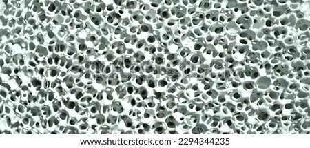 A close-up macro shot of a ceramic-coated sponge created by nanotechnology research to be used as a new type of desiccant in the industry. Royalty-Free Stock Photo #2294344235