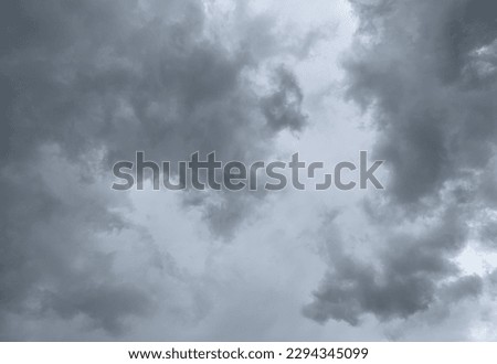 Huge gray nimbostratus clouds rise into the sky. and develop into cumulonimbus clouds there is a storm with thunder and lightning heavy rain at Bangkok, Thailand.no focus