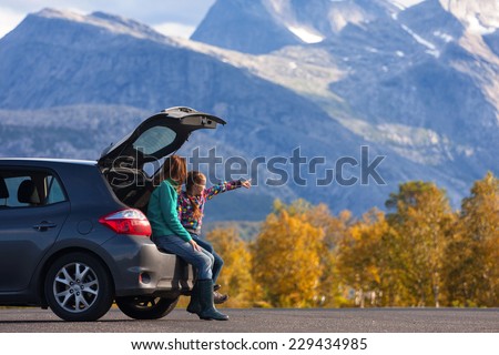 Mom and daughter - tourist girls and mountain views  Royalty-Free Stock Photo #229434985