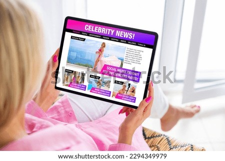 Woman reading gossip news about celebrities, fashion and entertainment