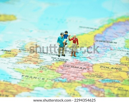 Miniature toy with blurred map as a background.