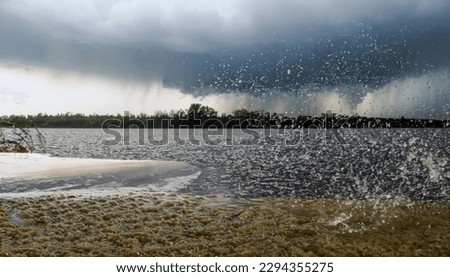 violent hailstorm with water on the ground on street photo. High quality photo