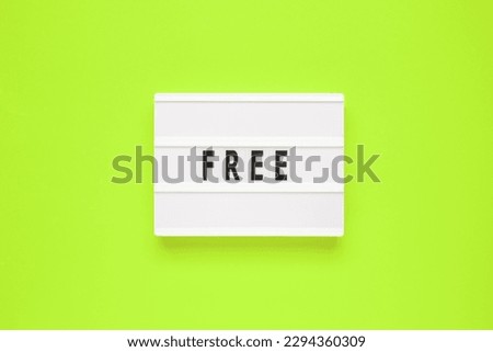The word free on lightbox isolated green background.