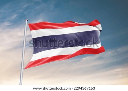 Waving flag of Thailand in beautiful sky. Thailand flag for independence day. The symbol of the state on wavy fabric.
