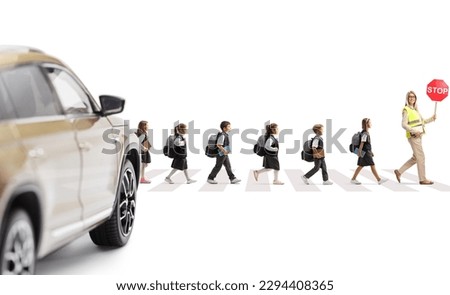 Car waiting at pedestrian crossing and teacher with stop sign and schoolchildren walking across street isolated on white background