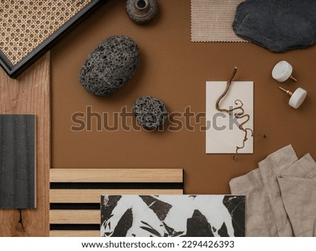 Stylish flat lay composition in brown, gray and beige color palette with textile and paint samples, lamella panels and tiles. Architect and interior designer moodboard. Top view. Copy space. 
