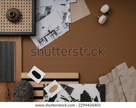 Modern flat lay composition in brown and beige color palette with textile and paint samples, lamella panels and tiles. Architect and interior designer moodboard. Top view. Copy space. 