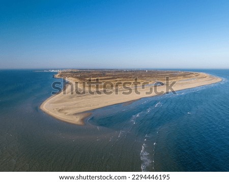 The tip of Skagens Gren (the northermost tip of the Jutland penisula) where the Baltic Sea and the North Sea meet. Point where the Kattegat and Skagerrak Seas meet, creating crashing waves. Royalty-Free Stock Photo #2294446195