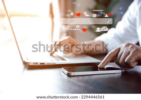 Searching information data on internet networking concept. Data Search Technology Search Engine Optimization. Women's hands are using mobile phone with computer keyboard to Searching for information.