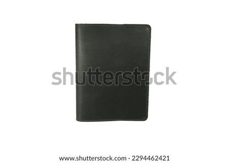 Black colour leather fabric hardcover notebook with elastic band lay back on white surface. Top view with notebook closed. Isolated on white background. For mockup, branding advertising. 