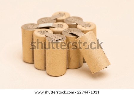 Bundle of Soldered Ni-Mh Rechargeable Batteries  Placed Together Over Beige background.Horizontal image Royalty-Free Stock Photo #2294471311